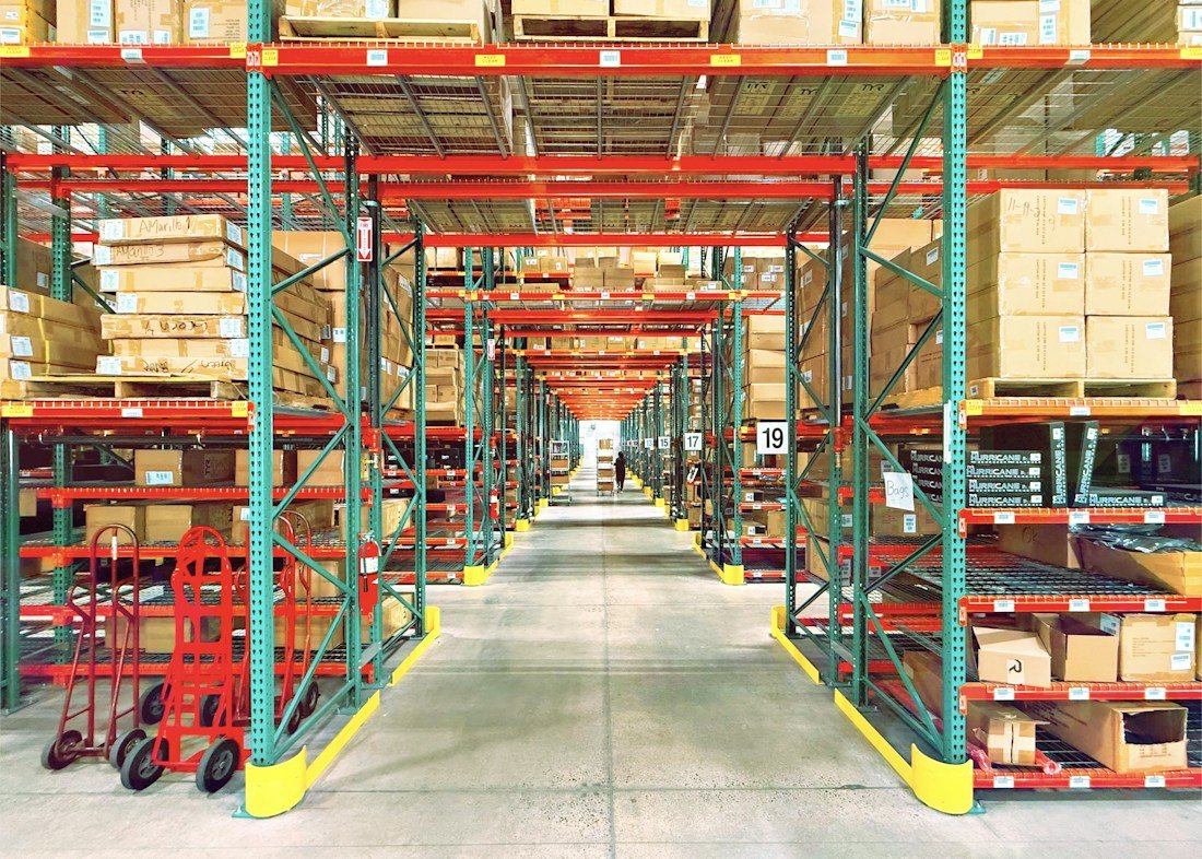 Warehouse aisle with products and boxes, illustrative commerce photography